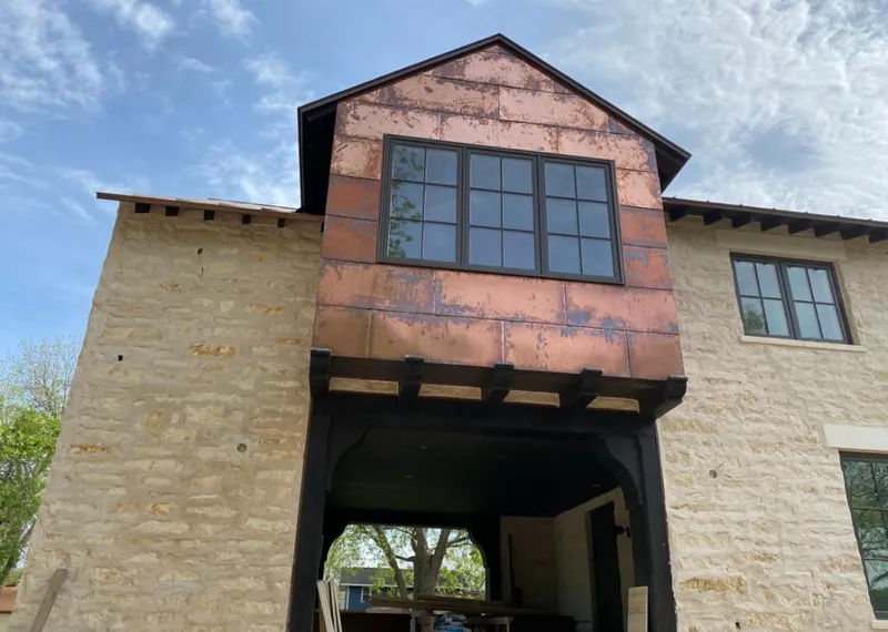 Copper metal panel facade on a stone building for Skylight Installation in Elkins